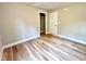 A spacious bedroom with modern flooring and a closet, providing ample storage at 2612 Alder Ridge Ln, Raleigh, NC 27603