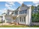Charming two-story home featuring white siding and navy shutters with a well manicured front yard at 2612 Alder Ridge Ln, Raleigh, NC 27603