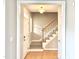 Inviting foyer features hardwood floors, stairs leading to the second floor, and a front door with sidelight at 2612 Alder Ridge Ln, Raleigh, NC 27603