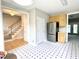 Open kitchen features stainless steel appliances, light wood cabinets, and patterned floor at 2612 Alder Ridge Ln, Raleigh, NC 27603