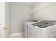 Convenient laundry room with modern white washer and dryer units at 2612 Alder Ridge Ln, Raleigh, NC 27603