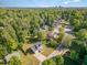 Aerial view of a home nestled among lush trees in a residential neighborhood at 2708 Tryon Pines Dr, Raleigh, NC 27603