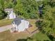 Aerial shot of a beautiful two-story home with a large backyard, deck, and mature trees at 2708 Tryon Pines Dr, Raleigh, NC 27603
