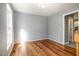 Bedroom with neutral walls, hardwood flooring, and natural light through a window at 2708 Tryon Pines Dr, Raleigh, NC 27603