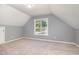 Comfortable bedroom featuring neutral carpet and a window that offers an outdoors view at 2708 Tryon Pines Dr, Raleigh, NC 27603
