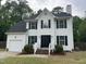 Picture of the delightful two-story home with a manicured lawn, and an attached garage at 2708 Tryon Pines Dr, Raleigh, NC 27603