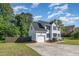 Charming two-story home with a well-manicured lawn, attached garage and inviting curb appeal at 2708 Tryon Pines Dr, Raleigh, NC 27603