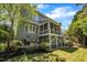Exterior view of a home showing a screened-in porch and a stone paver patio area, perfect for outdoor entertaining at 2723 Cameron Pond Dr, Cary, NC 27519