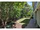 Backyard view showing a black iron fence and wooded area at 2723 Cameron Pond Dr, Cary, NC 27519