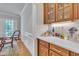 Elegant bar area with custom cabinetry, marble countertop, and decorative accents at 2723 Cameron Pond Dr, Cary, NC 27519