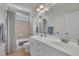 Well-lit bathroom with double vanity, tiled shower and tub, and neutral color scheme at 2723 Cameron Pond Dr, Cary, NC 27519