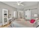 Comfortable bedroom features a work desk, and neutral decor, providing a calm and productive environment at 2723 Cameron Pond Dr, Cary, NC 27519