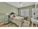 Stylish bedroom with a plush bed, glass side tables, and ample natural light, creating a serene and inviting space at 2723 Cameron Pond Dr, Cary, NC 27519