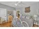 Calming bedroom with a plush bed, hardwood floors, and natural light from a bright window for a peaceful retreat at 2723 Cameron Pond Dr, Cary, NC 27519