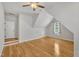 Bright, open bonus room with hardwood floors, vaulted ceiling, recessed lighting and a cozy atmosphere at 2723 Cameron Pond Dr, Cary, NC 27519