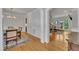 Spacious dining room featuring hardwood floors, an elegant chandelier, and an archway to other rooms at 2723 Cameron Pond Dr, Cary, NC 27519