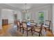 Well-lit dining room with hardwood floors, classic decor, and views to the entry hall at 2723 Cameron Pond Dr, Cary, NC 27519