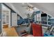Well-lit upper-level gym features carpeted floor, blue walls, and plenty of workout equipment at 2723 Cameron Pond Dr, Cary, NC 27519