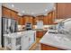 Well-appointed kitchen featuring stainless steel appliances, custom cabinetry, and white marble island at 2723 Cameron Pond Dr, Cary, NC 27519