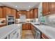 Gourmet kitchen featuring stainless steel appliances, custom cabinets, and marble countertops at 2723 Cameron Pond Dr, Cary, NC 27519
