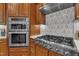 Gourmet kitchen boasts a professional Thor gas range and double oven at 2723 Cameron Pond Dr, Cary, NC 27519