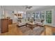 Bright living room with hardwood floors, neutral decor, and large windows offering natural light at 2723 Cameron Pond Dr, Cary, NC 27519