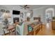 Living room with fireplace, hardwood floors, and view of staircase at 2723 Cameron Pond Dr, Cary, NC 27519