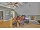 Spacious upstairs office with plenty of seating, natural light, and hardwood floors at 2723 Cameron Pond Dr, Cary, NC 27519