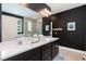 Modern bathroom featuring a double vanity with a quartz countertop and a separate glass-enclosed shower at 273 Scarlet Tanager Cir, Holly Springs, NC 27540
