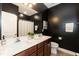 Nicely finished bathroom featuring a double vanity, and a shower-tub with modern fixtures at 273 Scarlet Tanager Cir, Holly Springs, NC 27540