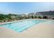 Sparkling community pool with plenty of seating, perfect for relaxing and enjoying the summer sun at 273 Scarlet Tanager Cir, Holly Springs, NC 27540
