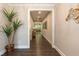 Open foyer with hardwood floors, elegant decor, and a view into the spacious living area at 273 Scarlet Tanager Cir, Holly Springs, NC 27540
