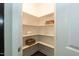 Walk-in pantry with multiple shelves and ample storage space at 273 Scarlet Tanager Cir, Holly Springs, NC 27540