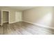 Basement room with new floors and access to bathroom at 273 Scarlet Tanager Cir, Holly Springs, NC 27540