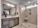 Spa-like bathroom with glass shower, linen cabinet and quartz countertop at 3004 Dog Rose Dr # 309, Durham, NC 27703