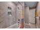 Stylish bathroom featuring a shower-tub combo with tiled walls and convenient inset shelving at 3004 Dog Rose Dr # 309, Durham, NC 27703