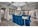 Dining area showcasing stylish lighting fixture and seamless access to a modern kitchen at 3004 Dog Rose Dr # 309, Durham, NC 27703