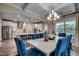 Dining room featuring stylish lighting fixture and seamless access to a modern kitchen at 3004 Dog Rose Dr # 309, Durham, NC 27703