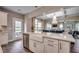 Well-lit kitchen boasts a large sink, stainless steel dishwasher, and seamless transition to the living area at 3004 Dog Rose Dr # 309, Durham, NC 27703