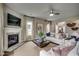 Inviting living room with fireplace, neutral decor, and view of open floor plan at 3004 Dog Rose Dr # 309, Durham, NC 27703