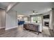Open concept living room featuring wood floors, a fireplace, and seamless flow to dining area at 3004 Dog Rose Dr # 309, Durham, NC 27703