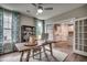 Home office offers a desk, built-in shelving, and view into the well-equipped modern kitchen at 3004 Dog Rose Dr # 309, Durham, NC 27703