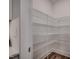 Walk-in pantry with ample shelving for organized storage and easy access at 3004 Dog Rose Dr # 309, Durham, NC 27703