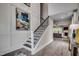 View of the staircase with decorative iron railing and a view to the living room at 3004 Dog Rose Dr # 309, Durham, NC 27703