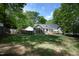 Spacious backyard with a home, porch, deck, and a privacy fence at 320 Delvin Lane Ln, Hillsborough, NC 27278