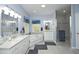 Bright bathroom with double vanity, separate shower, soaking tub, and tile floors at 320 Delvin Lane Ln, Hillsborough, NC 27278