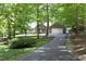 Lovely home with an attached garage nestled amidst towering trees accessible by a long paved drive at 320 Delvin Lane Ln, Hillsborough, NC 27278