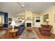 Open living room featuring a fireplace, built-in shelving, hardwood floors, and neutral paint palette at 320 Delvin Lane Ln, Hillsborough, NC 27278