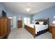 Serene bedroom with a comfortable queen size bed, a ceiling fan, and easy access to a full ensuite at 320 Delvin Lane Ln, Hillsborough, NC 27278