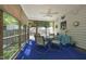 Screened in porch with a dining table and ceiling fan at 320 Delvin Lane Ln, Hillsborough, NC 27278